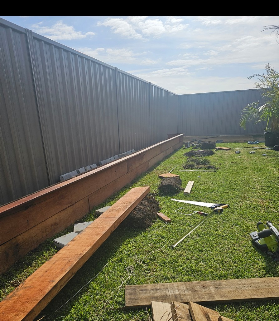 Karnup backyard garden bed under construction with timber retaining materials