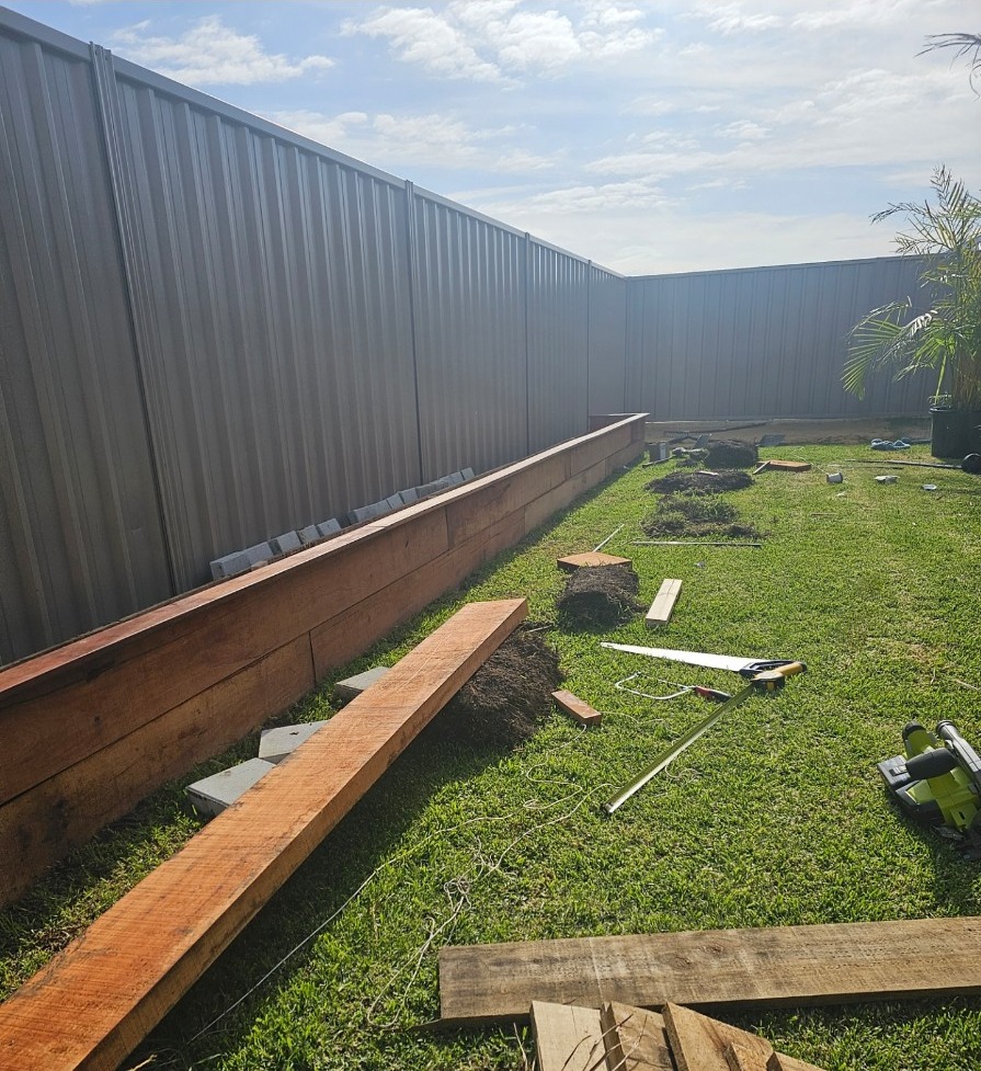Karnup backyard garden bed under construction with timber retaining materials